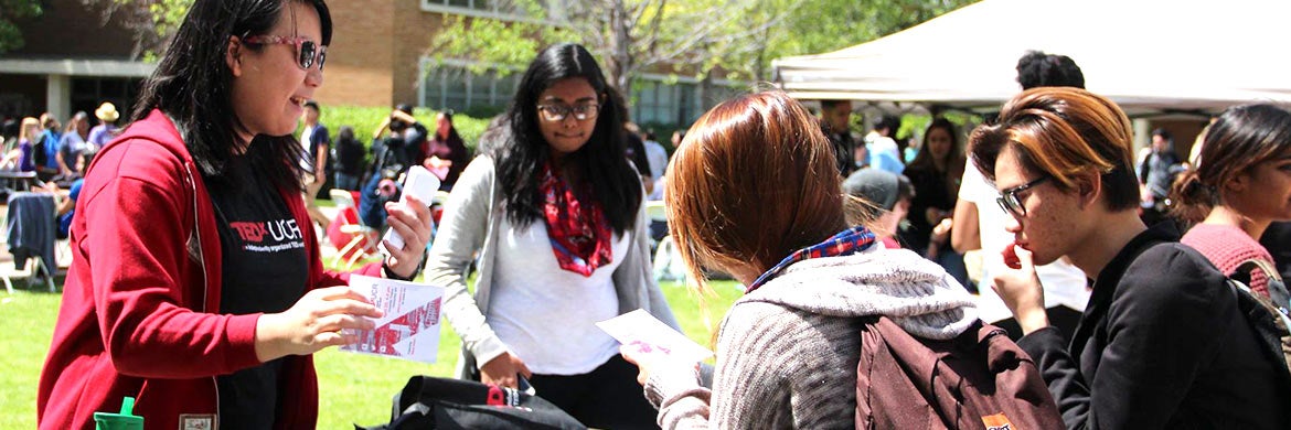 Members of a student organization talk with other students at a campus Involvment Fair.
