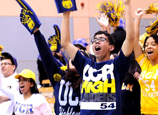 UCR students cheer on The Highlanders during a game.