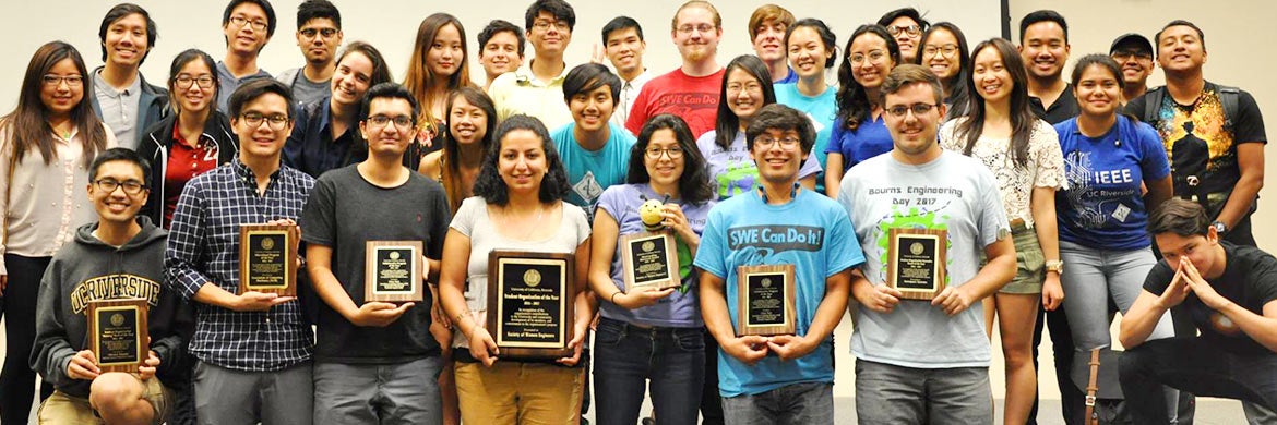Members of student organizations pose with their awards during a Student Life awards ceremony.