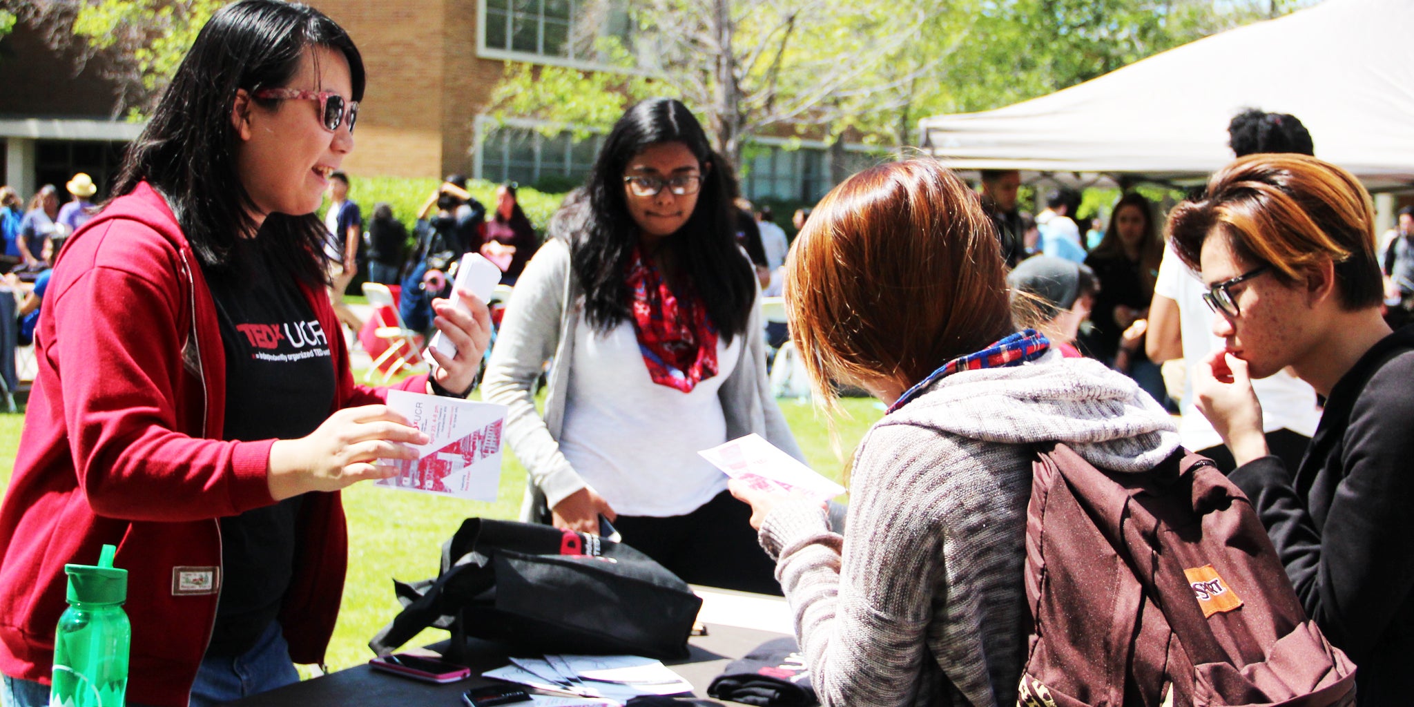 Students talk during a tabling event on campus.