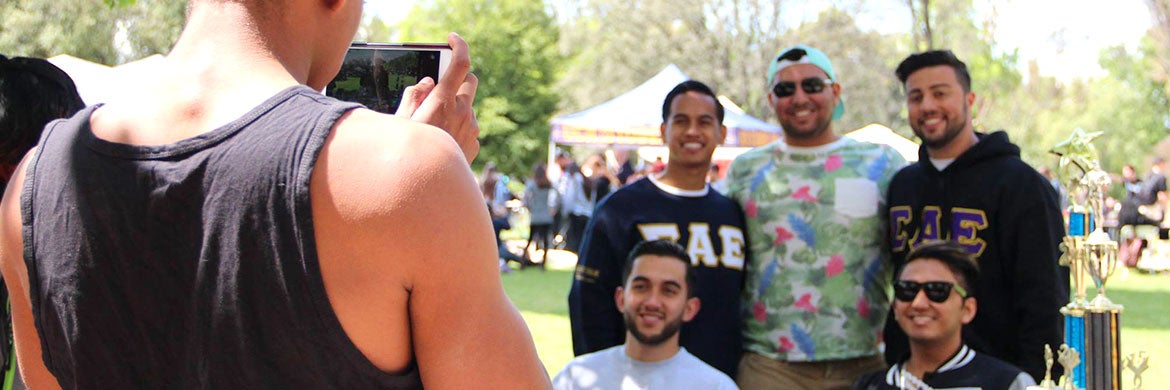 Members of a UCR fraternity pose for a picture during the Involvement Fair.