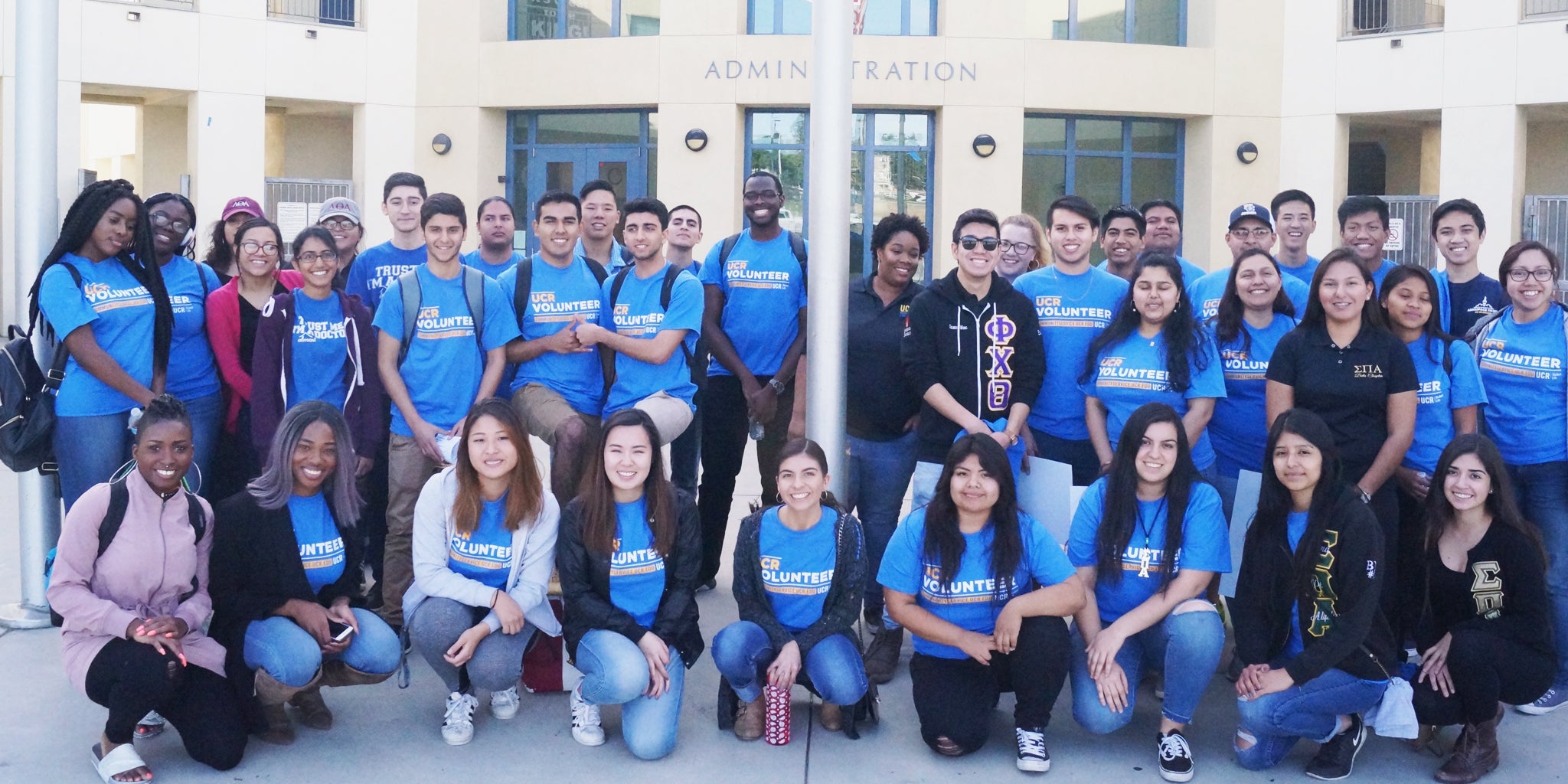 A group of UCR student volunteers pose together during a community service project.